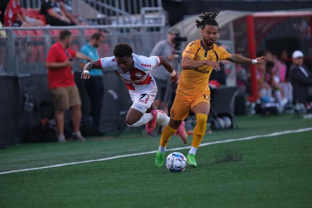 Rhode Island FC's Wesley Leggett versus Loudoun United FC's Noah Fuson