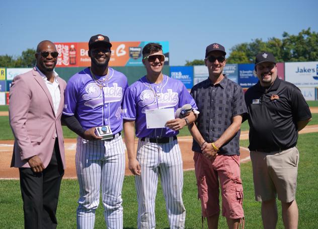 Ramon Santos and Aaron Antonini of the Long Island Ducks accept their awards