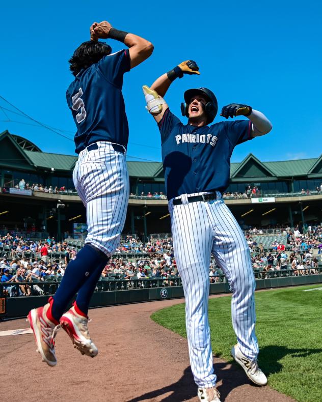 Somerset Patriots center fielder Spencer Jones (right) celebrates his homer