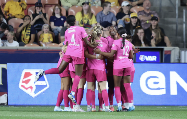 San Diego Wave FC gather after a goal