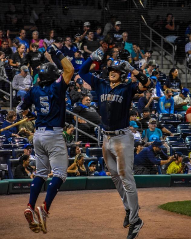 Somerset Patriots catcher Rafael Flores celebrates his home run