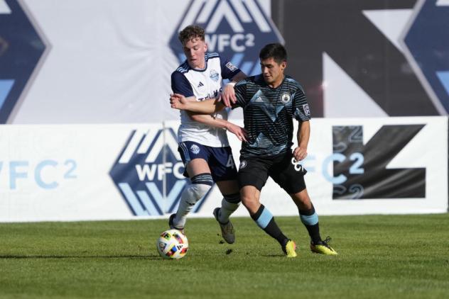 Whitecaps FC 2'S Eliot Goldthorp battles Tacoma Defiance's Kalani Kossa-Rienzi