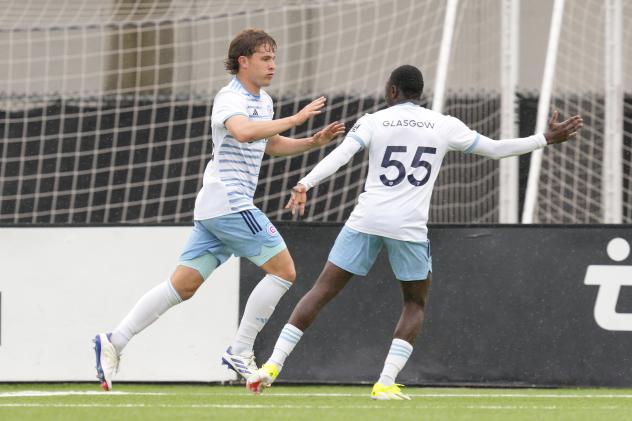 David Poreba (left) celebrates his goal with Chicago Fire FC II teammate Omari Glasgow
