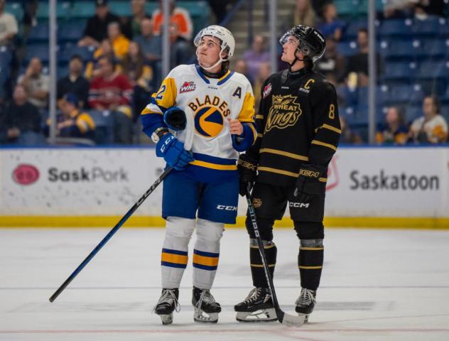 Saskatoon Blades defenceman Ben Saunderson (left)