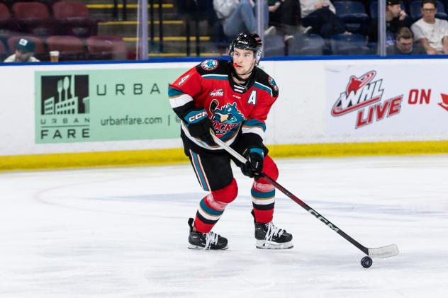 Caden Price handles the puck for the Kelowna Rockets