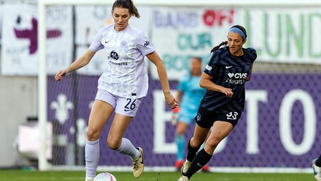 Racing Louisville midfielder Taylor Flint handles the ball