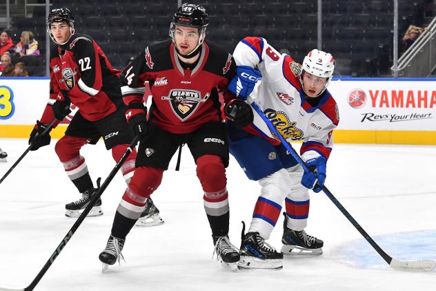 Vancouver Giants defenceman Marek Howell (center) vs. the Edmonton Oil Kings