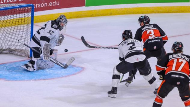 Wichita Thunder's Aaron Dell and Nico Somerville battle Kansas City Mavericks' Charlie Wright and Jackson Berezowski