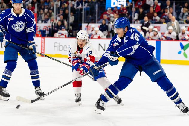 Syracuse Crunch defenseman Steven Santini (right) vs. the Laval Rocket