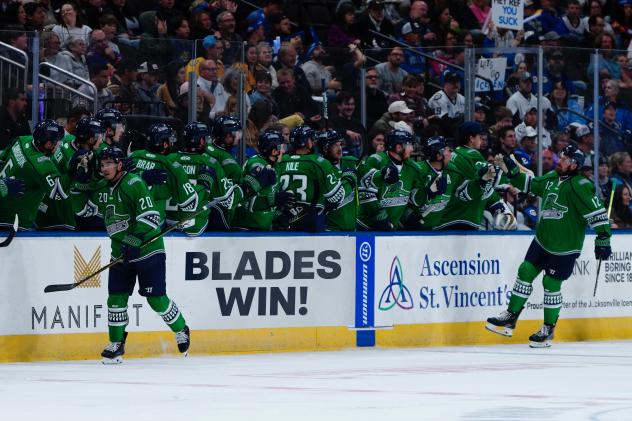 Florida Everblades' Oliver Chau and Andrew Fyten congratulated by team