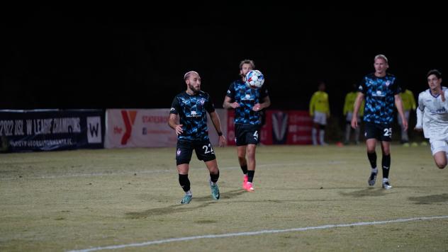 South Georgia Tormenta FC's Aaron Lombardi, Curtis Thorn, and Jake Dengler on the field
