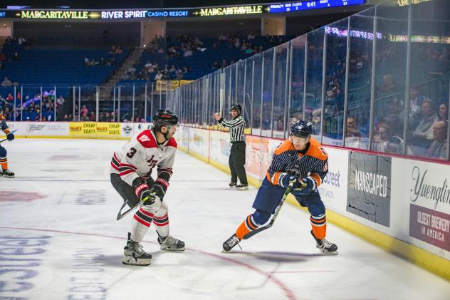 Rapid City Rush defenseman Zack Hoffman (left) vs. the Tulsa Oilers