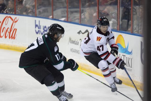 Utah Grizzlies' Reed Lebster battles Rapid City Rush's Charles Martin
