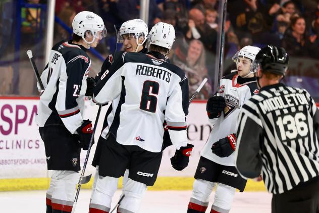 Vancouver Giants gather following a goal