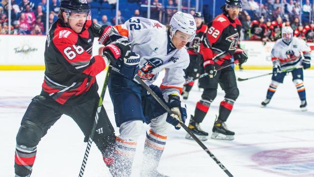 Tulsa Oilers forward Ruslan Gazizov (center)