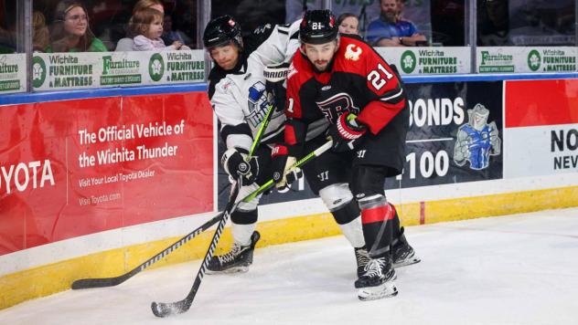 Wichita Thunder fights for control of the puck vs. the Rapid City Rush
