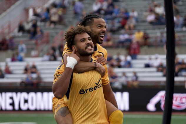 Rhode Island FC celebrate a playoff goal vs. Indy Eleven