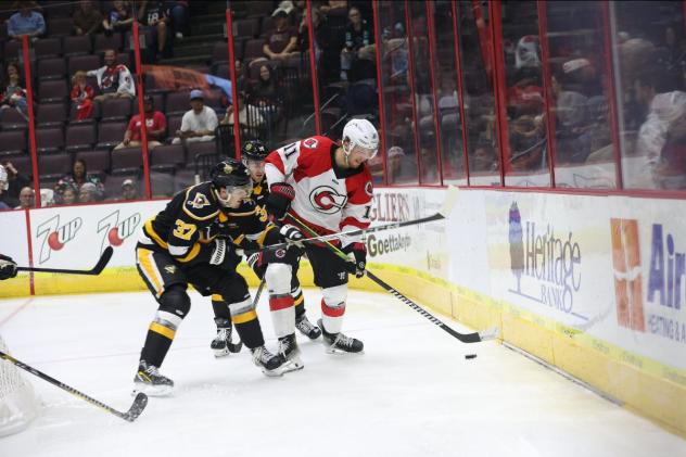 Wheeling Nailers forward Kyle Jackson (left) vs. the Cincinnati Cyclones