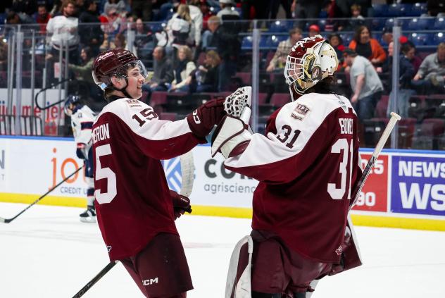 Carson Cameron and goaltender Zach Bowen of the Peterborough Petes