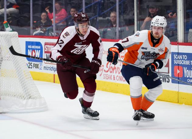 Peterborough Petes right wing Nico Addy (left) vs. the Flint Firebirds