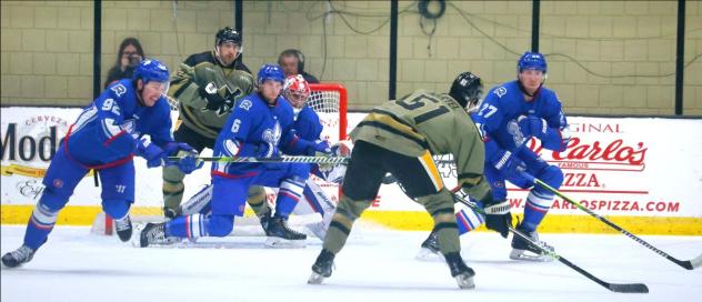 Wheeling Nailers' Jordan Martel battles Trois-Rivières Lions' Logan Nijhoff, Jacob Paquette, and Cory Thomas