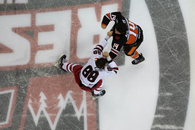 Rapid City Rush's Garrett Klotz battles Kansas City Mavericks' Daniel Amesbury