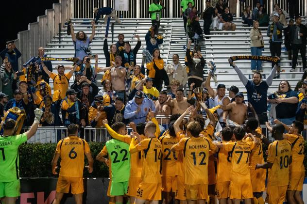 Rhode Island FC celebrates in front of its supporters