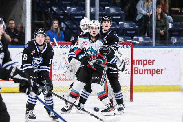 Jaxon Kehrig of the Kelowna Rockets fights for space against the Wenatchee Wild