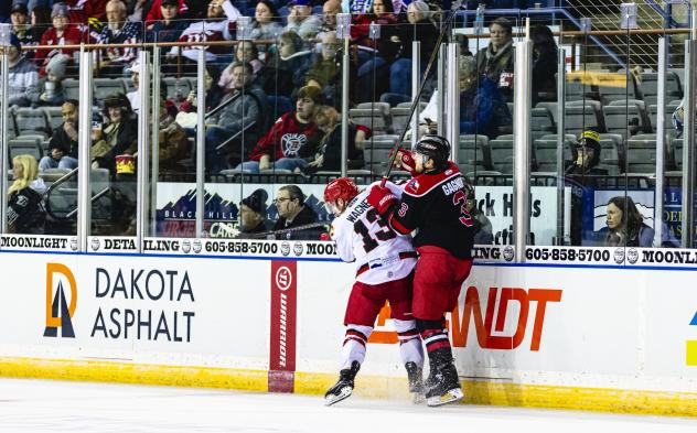 Allen Americans defenseman Ryan Gagnon (right) vs. the Rapid City Rush