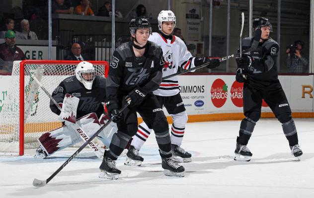 Peterborough Petes goaltender Easton Rye and defensemen Carson Cameron and Martin Matejicek (far right)