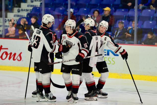 Vancouver Giants gather after a goal