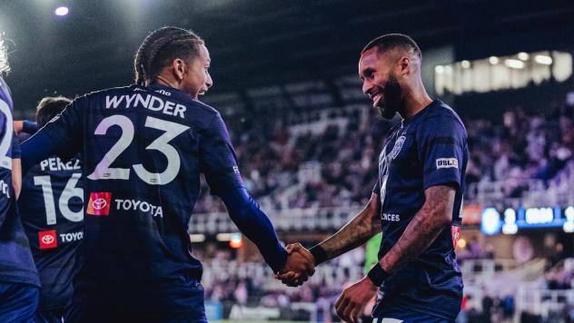 Louisville City FC players exchange congratulations