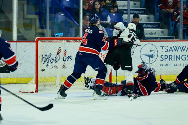 Vancouver Giants centre Jaden Lipinski creates traffic in front of the Regina Pats net