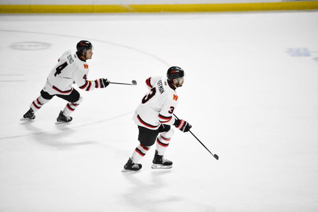 Rapid City Rush forward Simon Boyko (left) and defenseman Zack Hoffman