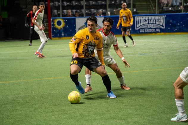 Alessandro Canale of the Tacoma Stars looks to pass while fending off a Chihuahua defender last season