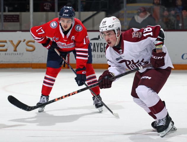 Peterborough Petes right wing Francis Parish (right) vs. the Oshawa Generals