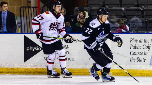 Wichita Thunder forward Michal Stinil (right) vs. the Rapid City Rush