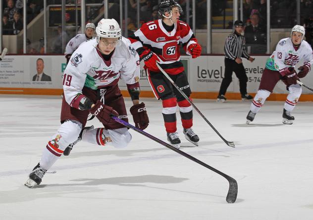 Peterborough Petes left wing Caden Taylor (left) vs. the Ottawa 67's