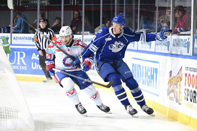 Rochester Americans' Kale Clague and Syracuse Crunch's Milo Roelens in action