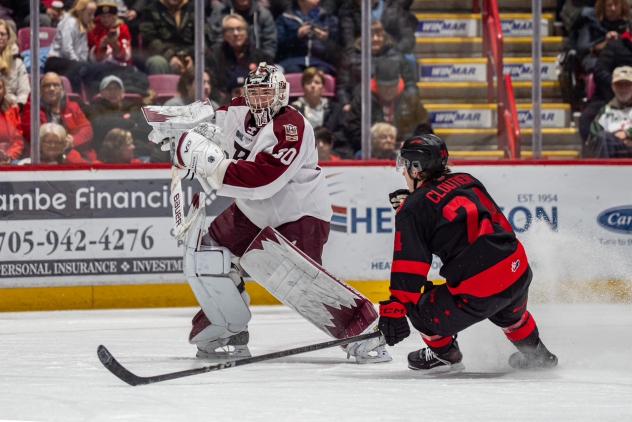 Peterborough Petes' Easton Rye and Soo Greyhounds' Justin Cloutier in action