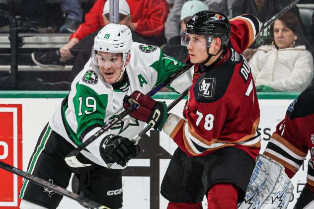 Tucson Roadrunners defenseman Artem Duda (right)