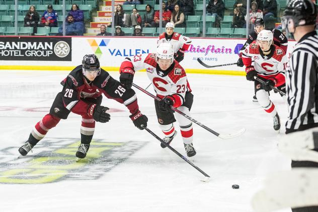 Vancouver Giants right wing Connor Levis (left) vs. the Prince George Cougars