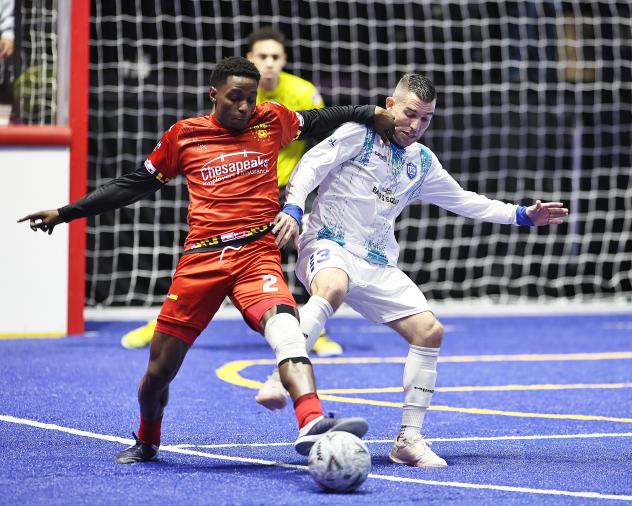 Baltimore Blast defender Oumar Sylla (left) vs. Utica City