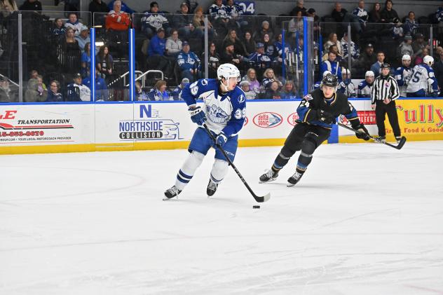 Syracuse Crunch's Gage Goncalves and Cleveland Monsters' Justin Pearson in action