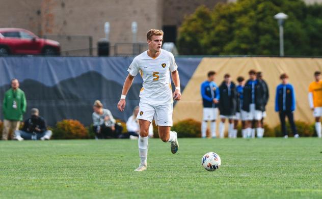 Defender Max Broughton with West Virginia University