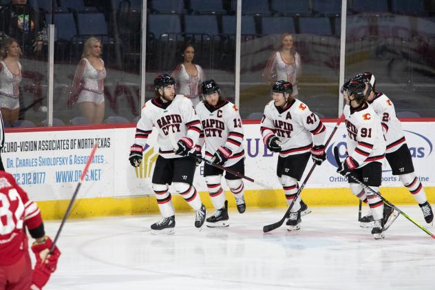 Rapid City Rush gather after scoring a goal