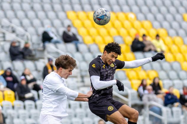 Pittsburgh Riverhounds go up for a header against Duquesne University