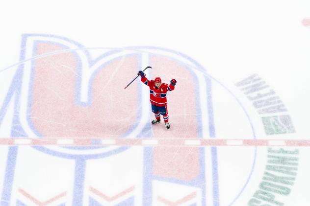 Shea Van Olm of the Spokane Chiefs celebrates at mid-ice