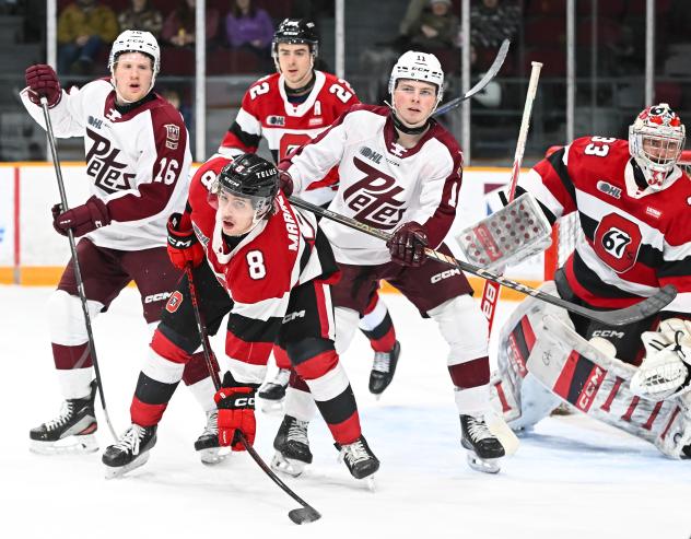 Peterborough Petes right wing Brady Stonehouse (far left) and centre Brody Partridge vs. the Ottawa 67's