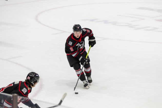 Adirondack Thunder's Ty Gibson (center) and Josh Filmon in action